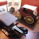 old stage coach and vintage car